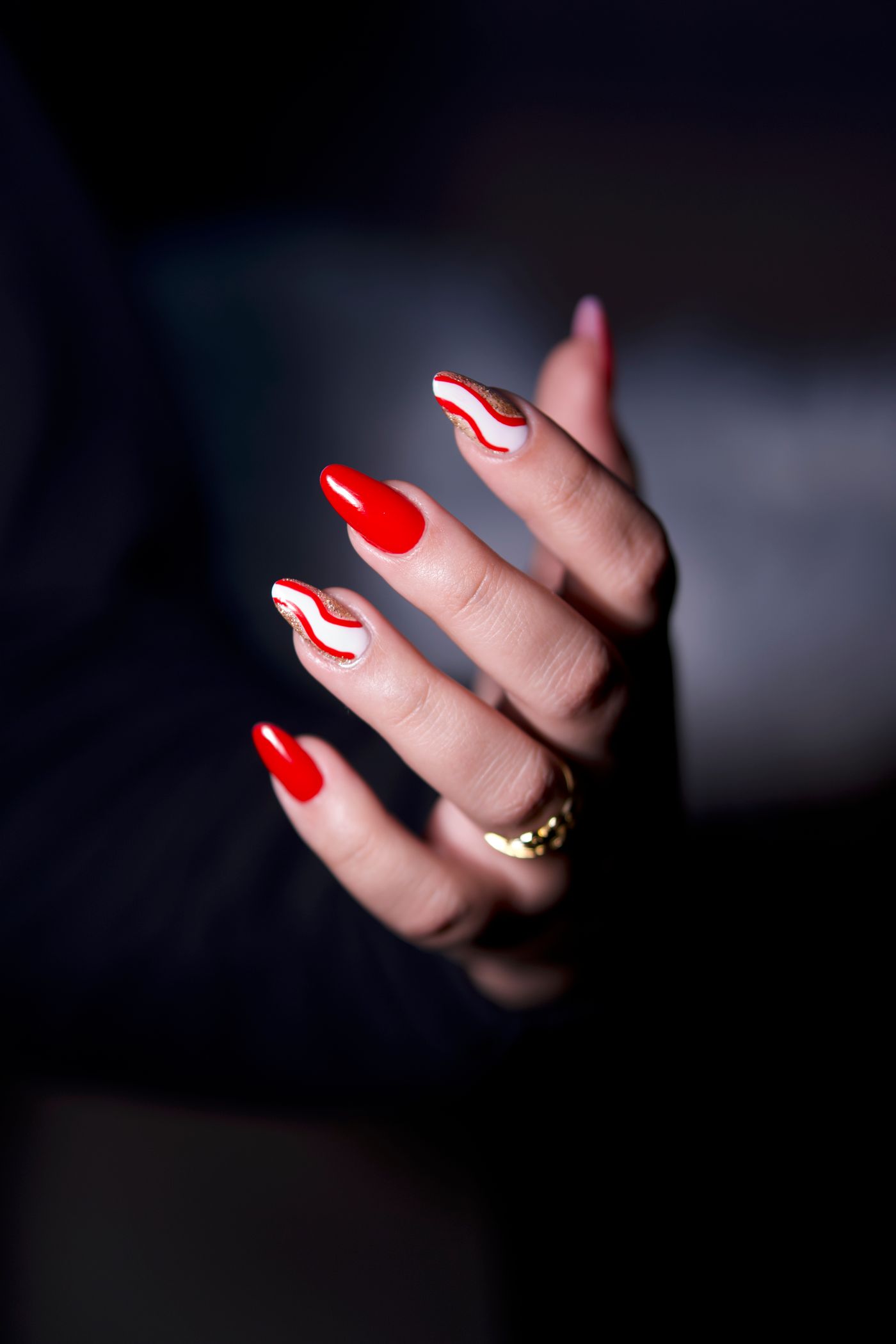 Bold red artistic manicure design